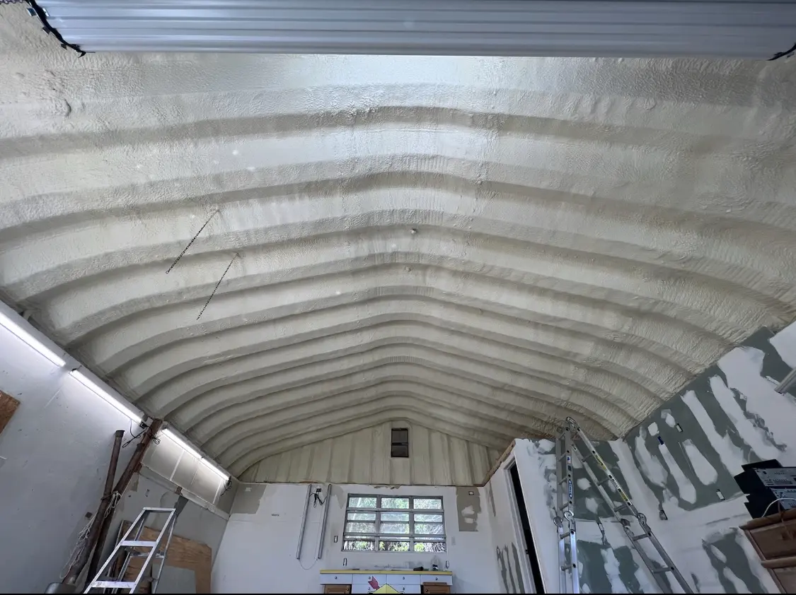Spray polyurethane foam applied to the underside of a metal roof deck in New Brighton